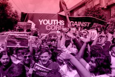 Youth in Nepal hold posters demanding an end to corruption during the Gen Z protests.